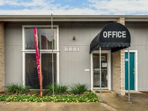 Arlington apartment for rent - A building with a black awning that says "OFFICE" on it.