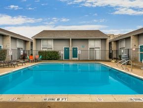 Arlington apartment for rent - A pool with a no diving sign in front of apartment buildings.