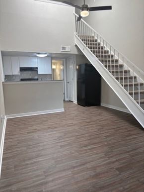 Fort Worth apartment for rent - A kitchen with a staircase leading to the upper floor.