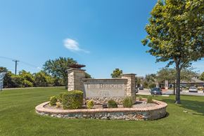 Sherman apartment for rent - A sign that says "The Bridges" stands in a grassy area.