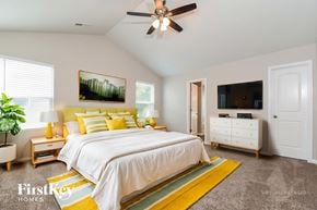 Kernersville house for rent - A bedroom with a bed, dresser, and a ceiling fan.