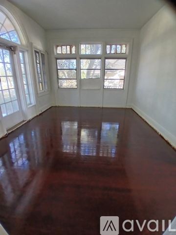 Lake Wales apartment for rent - A room with a wooden floor and white walls.