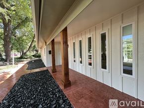 Plano house for rent - A house with a red pathway leading to it.