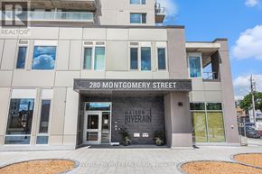 Ottawa condo for rent - The front of a building with the address 280 Montgomery Street and the name "Mason Riverain" on it.