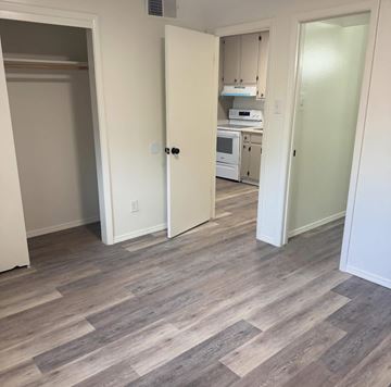 Albuquerque apartment for rent - A kitchen with a microwave, oven, and cabinets.