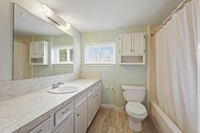Houston house for rent - A bathroom with a toilet, sink, and shower.