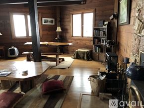 Snoqualmie Pass house for rent - A living room with a fireplace and a couch.
