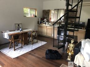 Middlesex house for rent - A living room with a wooden floor and a staircase.