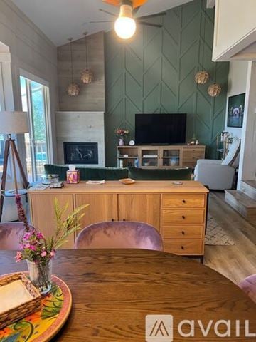 Incline Village condo for rent - A living room with a wooden table and a television.