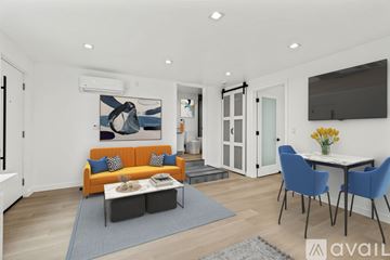 Los Angeles apartment for rent - A living room with a sofa, chairs, and a painting on the wall.
