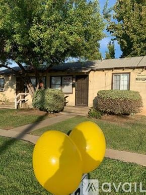 El Cajon house for rent - Two yellow balloons in front of a building with a sign that says "available".