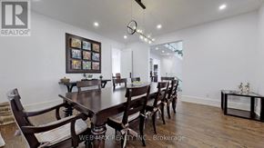 Toronto (St. Andrew-Windfields) house for rent - A dining room with a wooden table and chairs.