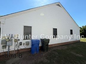 Wilson apartment for rent - A white building with the name J.W. Hunter Company, Inc. on it.