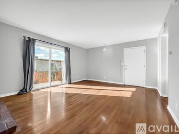 Kansas City condo for rent - A living room with a grey couch and a white coffee table.