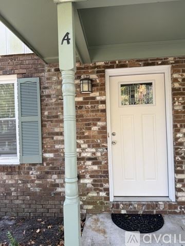 Surfside Beach townhouse for rent - A kitchen with white cabinets and a white refrigerator.