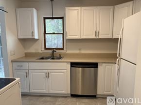 Surfside Beach townhouse for rent - A room with a ceiling fan and a door with a window.