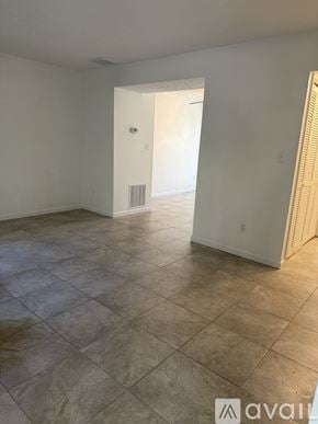 Surfside Beach townhouse for rent - A white toilet sits next to a bathtub in a bathroom.