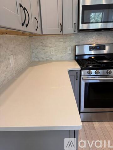 Rochester apartment for rent - A kitchen with a stove and a countertop.