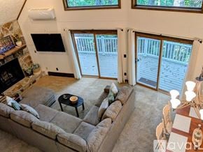 Dillard house for rent - A bedroom with a bed, a dresser, and a television.