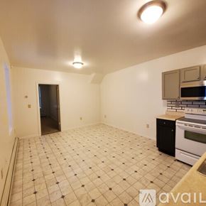 Williamsport apartment for rent - A kitchen with a black and white checkered floor.