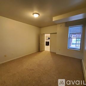 Williamsport apartment for rent - A room with beige carpeting and a window showing daylight.