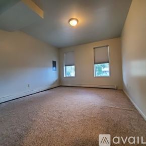 Williamsport apartment for rent - A room with a carpeted floor and two windows.
