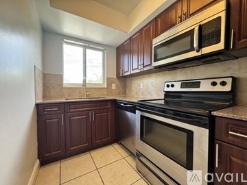 Delray Beach apartment for rent - A beachfront street with palm trees and a van driving down the road.
