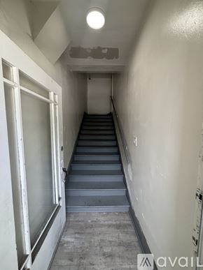 Los Angeles apartment for rent - A long flight of concrete stairs leads up to a door.