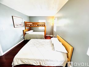 Ocean City apartment for rent - A bedroom with two beds and a single bed.