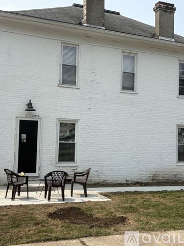 Urbana apartment for rent - A kitchen with a table and chairs in front of it.