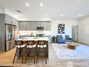 Boston apartment for rent - A modern kitchen with a dining table and chairs.