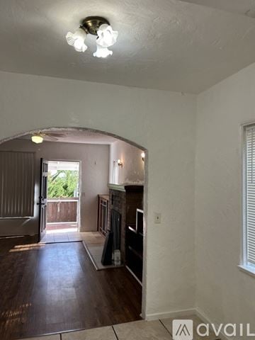 Lake Elsinore house for rent - A living room with a couch and a fireplace.