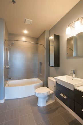 Pittsfield apartment for rent - a bathroom with a toilet and a tub and a sink