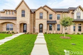 Mansfield house for rent - A large, well-maintained house with a brick facade and a front yard.