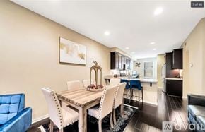 Irvine condo for rent - A dining room with a wooden table and chairs.