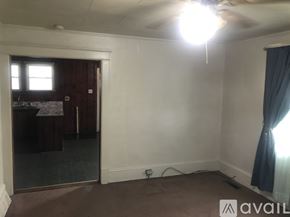 Goldsboro house for rent - A room with a ceiling fan and a window.