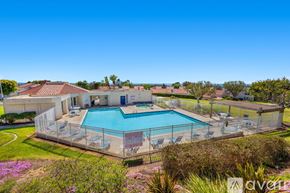 Carlsbad apartment for rent - A large backyard with a pool and a house.