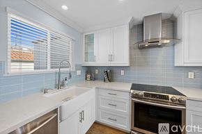 Carlsbad apartment for rent - A kitchen with white cabinets and a stainless steel oven.