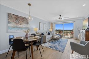 Carlsbad apartment for rent - A modern dining room with a table set for two and a view of the balcony.