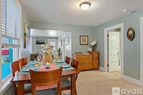 Coeur D'alene house for rent - A dining room with a table set for a meal.