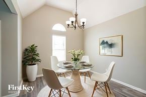 Hendersonville house for rent - A dining room with a glass table and chairs.