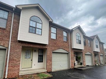 Bowling Green apartment for rent - A row of houses with garages in front.