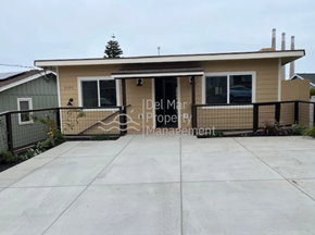Morro Bay house for rent - A house with a fence and a tree on the roof.
