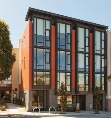 San Francicso apartment for rent - A modern building with a combination of orange and grey exterior.