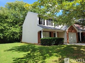 Atlanta house for rent - A house with a grey roof and a white garage door.
