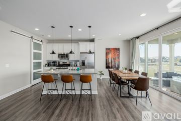 Henderson house for rent - A modern kitchen with a dining table and chairs.