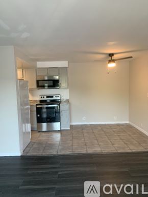 Cincinnati apartment for rent - A kitchen with a refrigerator, oven, and microwave.