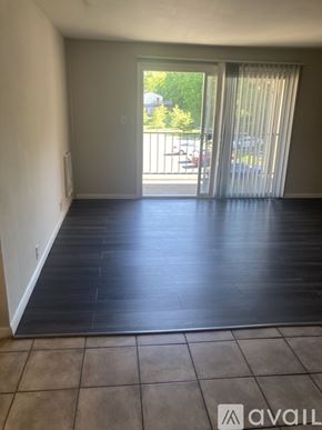 Cincinnati apartment for rent - A bathroom with a marble tile shower and a white toilet.