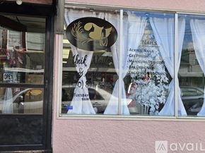 Scranton house for rent - A window display for a nail salon with a sign that reads "Whik Nails & Spa".