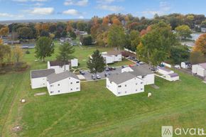 Fredericktown apartment for rent - A bird's eye view of a residential area with houses and trees.